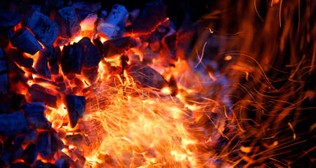 burning charcoal background with fire and sparks