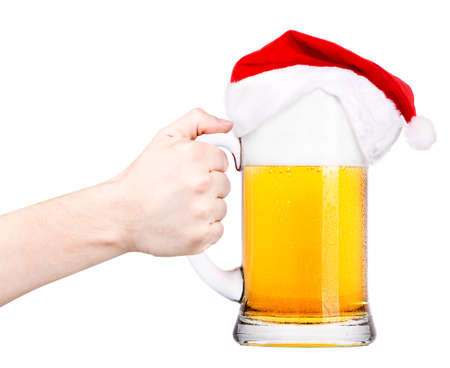 toast with Beer and hat of Santa Claus isolated on whiteの写真素材