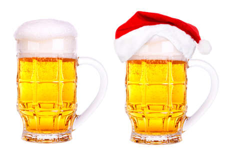 Beer and hat of Santa Claus isolated on whiteの写真素材