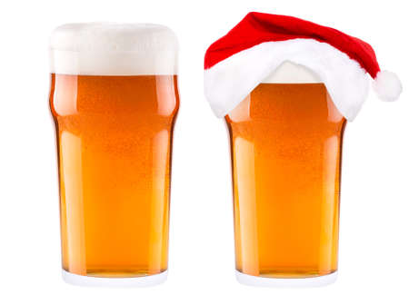 Beer and hat of Santa Claus isolated on whiteの写真素材