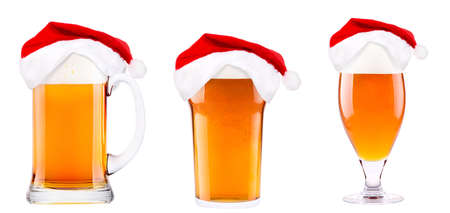 Beer and hat of Santa Claus isolated on whiteの写真素材