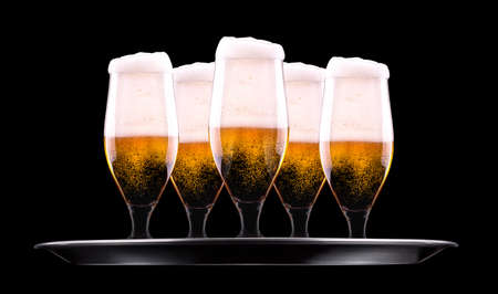 tray with Beer into glass on a blackの写真素材