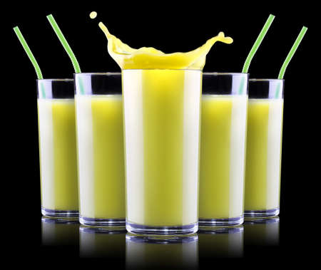 Delicious Smoothies of kiwi in glass with splash isolated on a black backgroundの写真素材