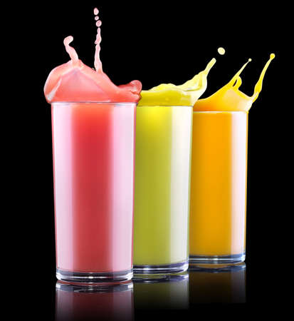  tasty summer fruit drinks in glass with splash isolated on a black backgroundの写真素材