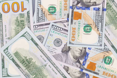 Lots of dollar notes arranged in chaotic manner, background