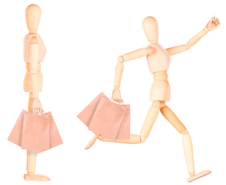 happy wooden Dummy with shopping bags isolatedの写真素材