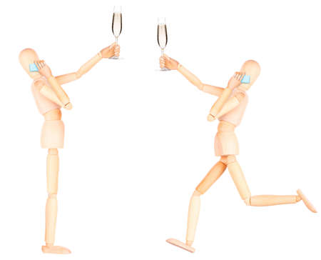 wooden Dummy with champagne talking on mobile phone Isolated on a white backgrondの写真素材