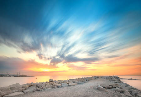 Barceloneta Beach in Barcelona with colorful sky at sunriseの写真素材