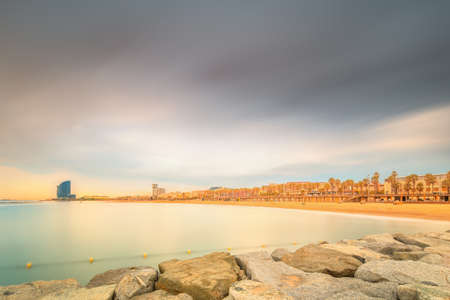 Barceloneta Beach in Barcelona at sunriseの写真素材