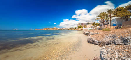 Paradise beach in Ibiza island with blue sky and crystal waterの写真素材