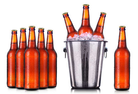 Set of beer's bottles with frosty drops in ice isolated on white backgroundの写真素材