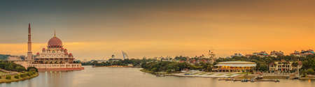 Sunset over Putrajaya Mosque and Panorama of Kuala Lumpur, Malaysia.の写真素材