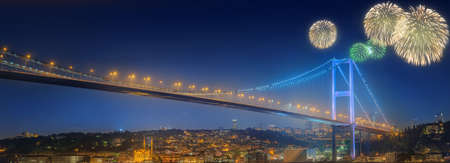 Cityscape with Galata Tower, Golden Horn and ferry wirh beautiful fireworks in Istanbul, Turkeyの写真素材