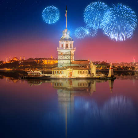 Cityscape with Galata Tower, Golden Horn and ferry wirh beautiful fireworks in Istanbul, Turkeyの写真素材