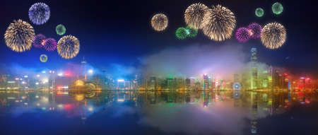 Beautiful fireworks under Hong Kong island, skyline and Financial district, Chinaの写真素材