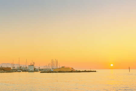 Barceloneta Beach in Barcelona with colorful sky at sunriseの写真素材