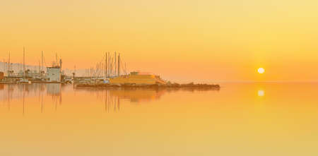 Barceloneta Beach in Barcelona with colorful sky at sunriseの写真素材