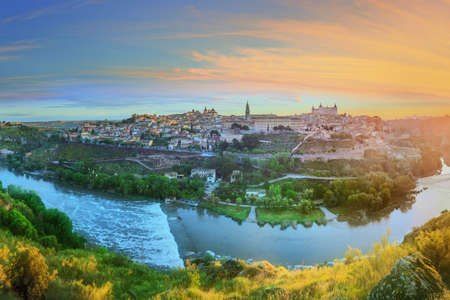 Panoramic view of ancient city and Alcazar on a hill over the Tagus River, Castilla la Mancha, Toledo, Spain.の写真素材