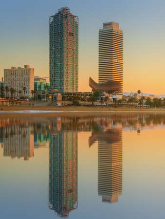 Barceloneta Beach in Barcelona with colorful sky at sunriseの写真素材