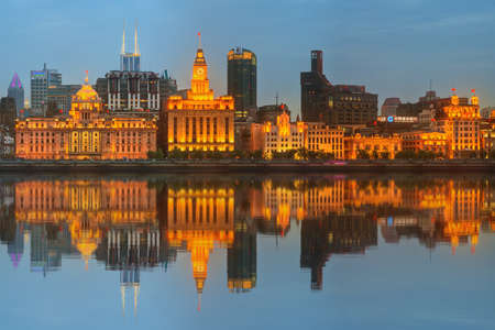 Skyline of The Bund, marvellous historical buildings and Huangpu River on sunset, Shanghai, China.の写真素材