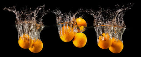 Group of fresh fruits falling in waterの写真素材