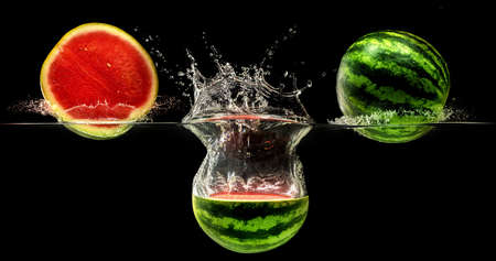Fresh melon falling in water