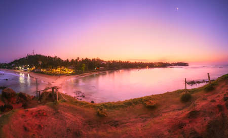 Tropical beach on sunsetの写真素材