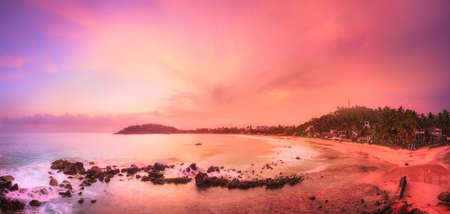 Tropical beach on sunsetの写真素材