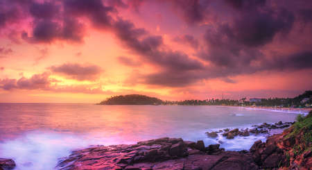 Tropical beach on sunsetの写真素材