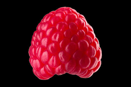 Macro photo of raspberry without leaves isolated on black background.