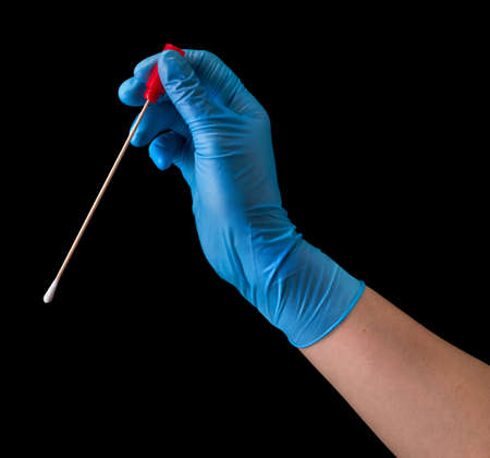 Doctors hand in medical gloves holding test tube with coronavirus COVID-19