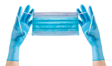 Doctors hand in medical gloves wearing a mask isolated on white