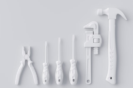 Top view of monochrome construction tools for repair and installation on whiteの写真素材