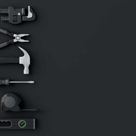 Top view of monochrome construction tools for repair and installation on blackの写真素材
