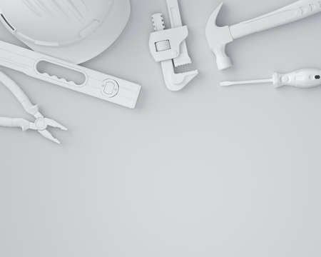 Top view of monochrome construction tools for repair and installation on white