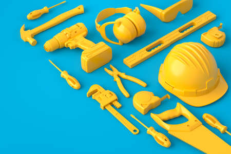 Isometric view of monochrome construction tools for repair on blue and yellowの写真素材