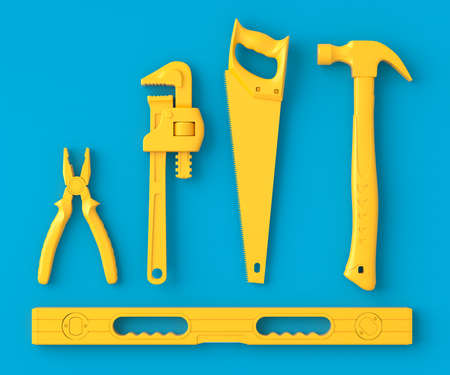 Top view of monochrome construction tools for repair and installation on blue and yellow background....