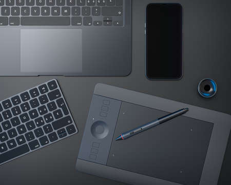 Top view of designer workspace and gear like laptop, tablet, keyboard and phone on black table...