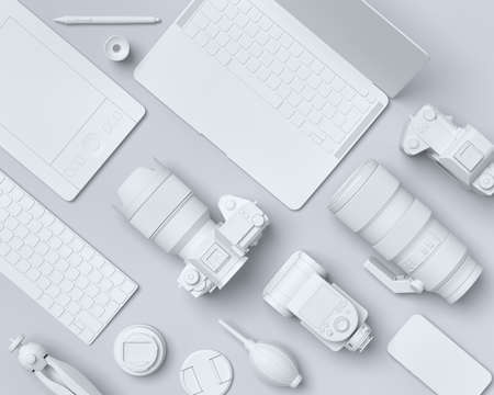 Top view of monochrome designer workspace and gear like laptop, tablet, digital camera and spidlight flash on black background. 3d rendering of accessories for illustrator and photography toolsの写真素材