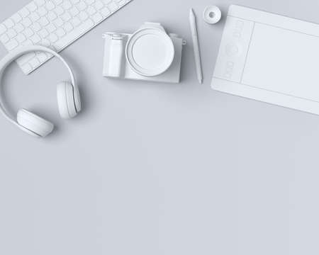 Top view of monochrome designer workspace and gear like laptop, tablet, digital camera and headphones on black background. 3d rednder of accessories for drawing and illustrator or photography toolsの写真素材
