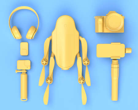 Top view of designer workspace and gear like nonexistent DSLR camera, headphones, drone and action camera on selfie stick on blue background. 3d rendering of accessories and photography toolsの写真素材