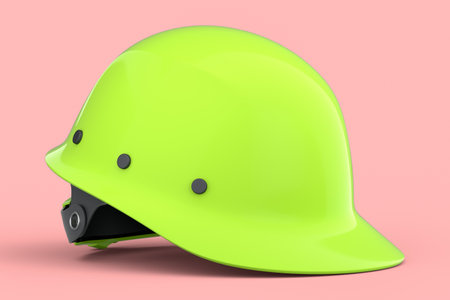 Green safety helmet or hard cap isolated on pink background. 3d render and illustration of headgear and handyman toolsの写真素材