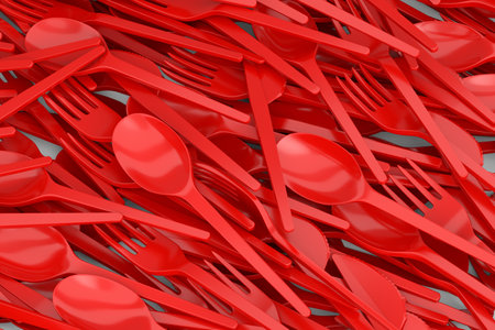 Heap of disposable utensils like spoon, fork and knife on white background.の写真素材
