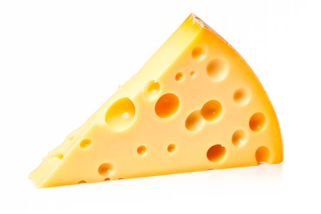 A closeup of cheese with holes like maasdam, emmental or cheddar as background.の素材