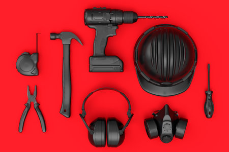 Top view of monochrome construction tools for repair on red background
