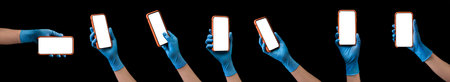 Doctor's hand in sterile medical gloves holding phone isolated on black background with clipping...