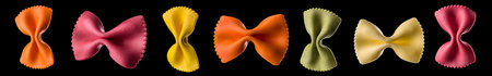 Macro photo of farfalle pasta isolated on black background with clipping path.