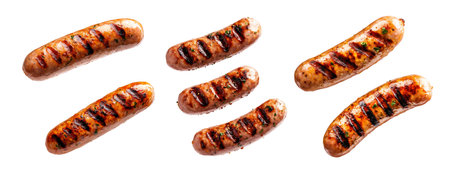 Set of Grilled pork sausages with char marks and herbs isolated on white transparent background, showcasing a delicious barbecue food conceptの素材