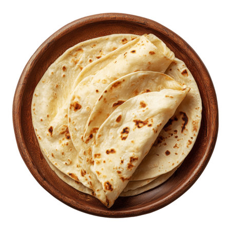 Soft golden flour tortillas or roti wraps arranged in rustic wooden plate, isolated on white transparent background, concept of traditional foodの素材