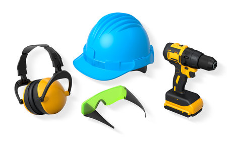Protective gear featuring helmet, earmuffs, cordless drill and goggles isolated on white background with clipping path, concept of safety construction wearの写真素材